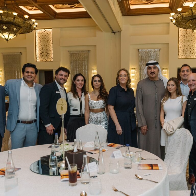 Group photo of eleven attendees at The Syndicate Global Dubai event at the One&Only in Dubai.