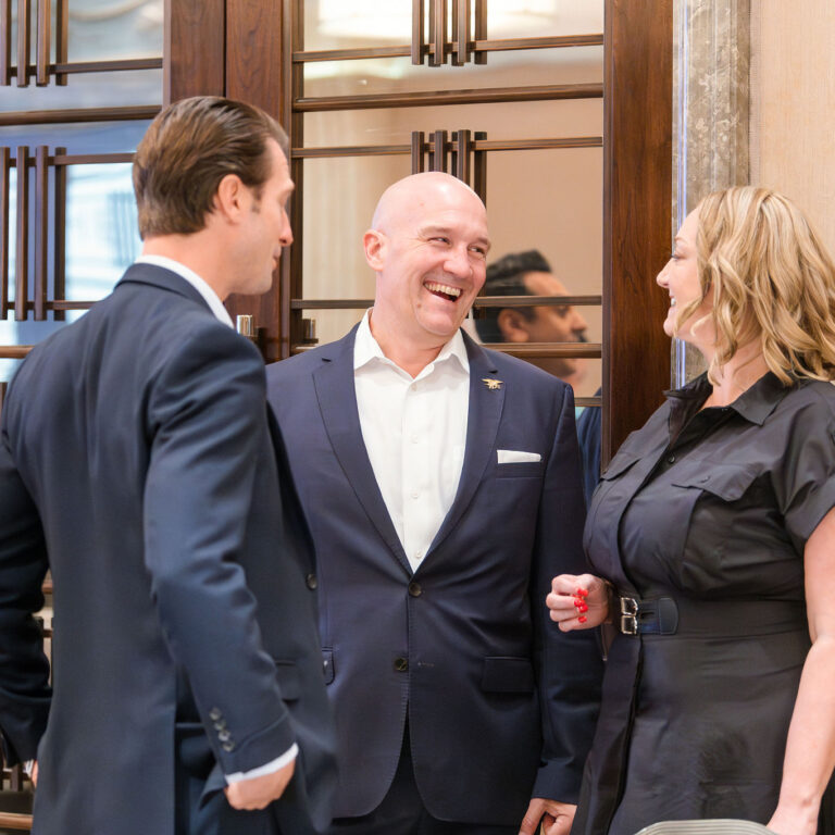 Guests engaged in conversation with Founder Alison Goodwin & entrepreneur Curt Croning (Broadway Strategic Fund) at The Syndicate Global event at The Connaught, networking among founders, investors, UHNW individuals and family offices.