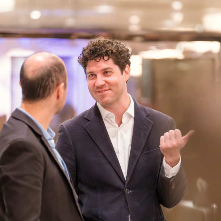 Guests engaged in conversation at The Syndicate Global event at The Connaught, networking among founders, investors, UHNW individuals and family offices.