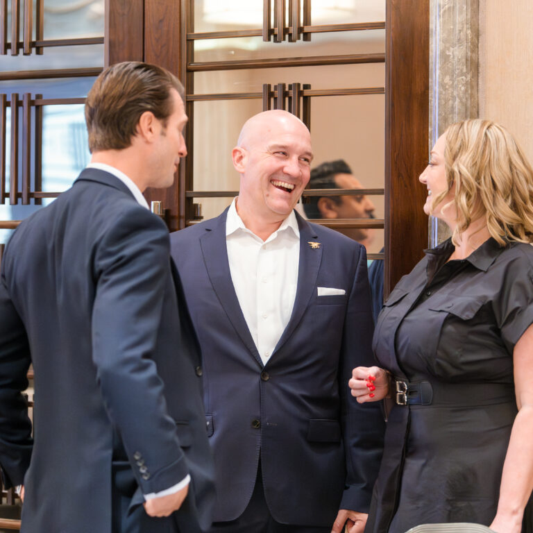 Guests engaged in conversation at The Syndicate Global event at The Connaught, networking among founders, investors, UHNW individuals and family offices.