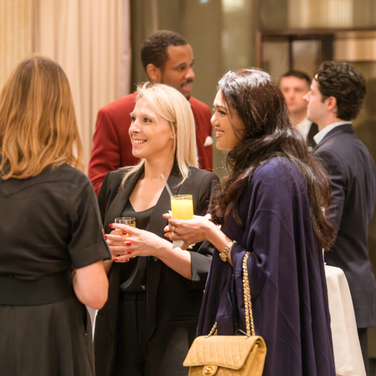 Guests engaged in conversation at The Syndicate Global event at The Connaught, networking among founders, investors, UHNW individuals and family offices.